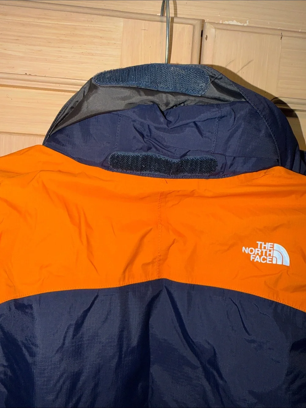 The North Face Kids Navy Blue and Orange Raincoat